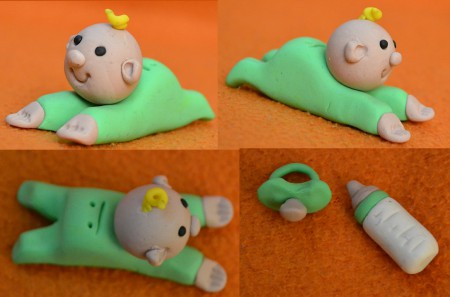 Bebe con biberon y chupete